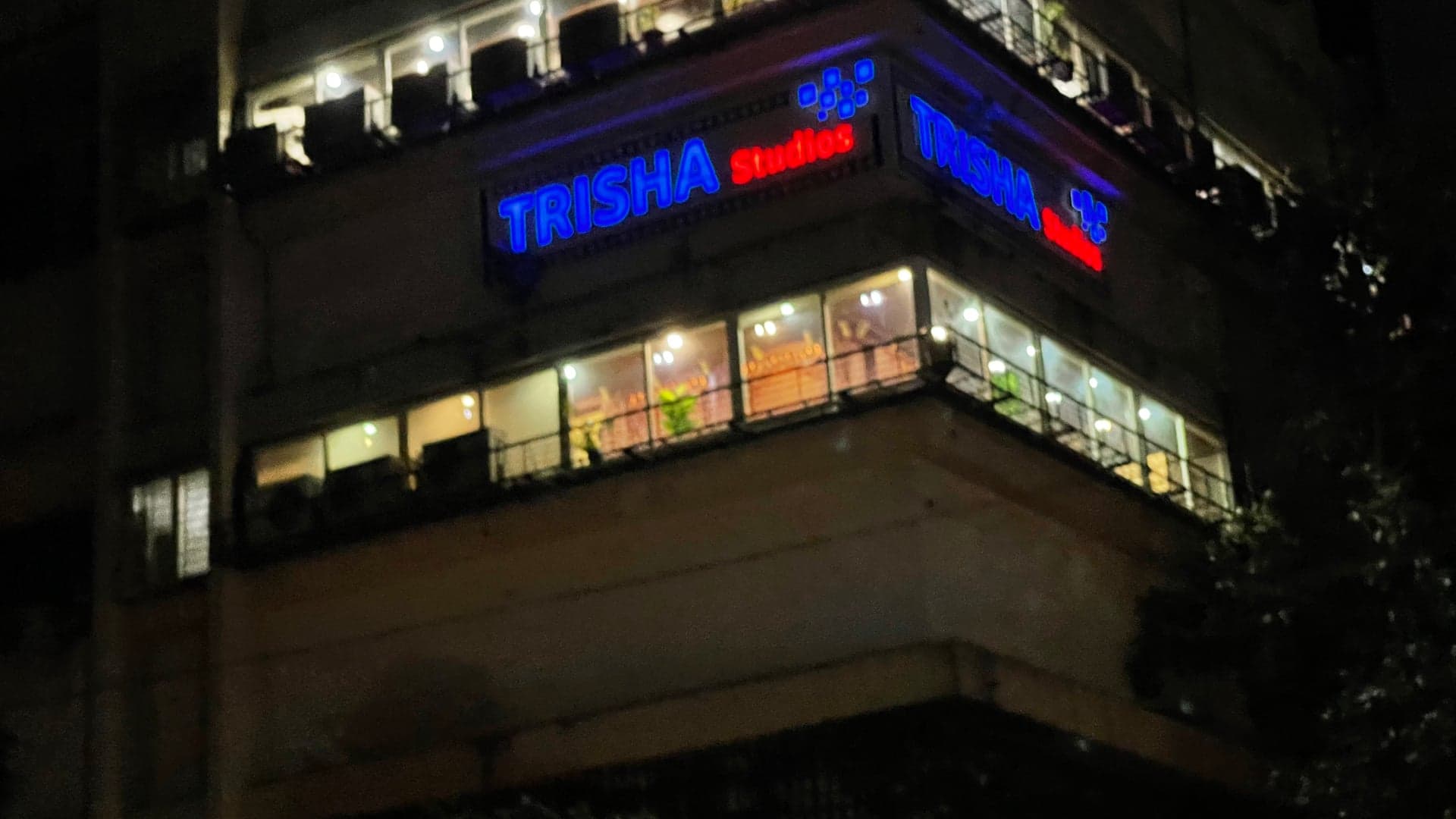 Trisha Studios sign on the Mumbai facility at night